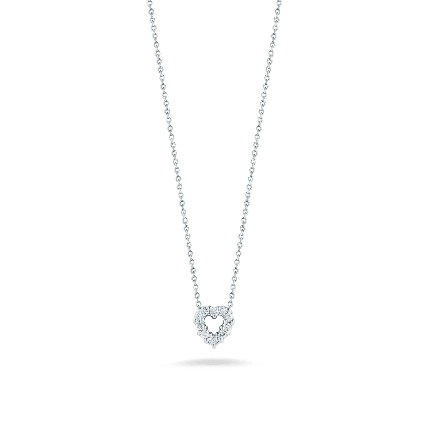 The Roberto Coin Tiny Treasures 18K White Gold Diamond Heart Necklace Pendant, crafted by the renowned brand Roberto Coin, is elegantly showcased on a simple white background.