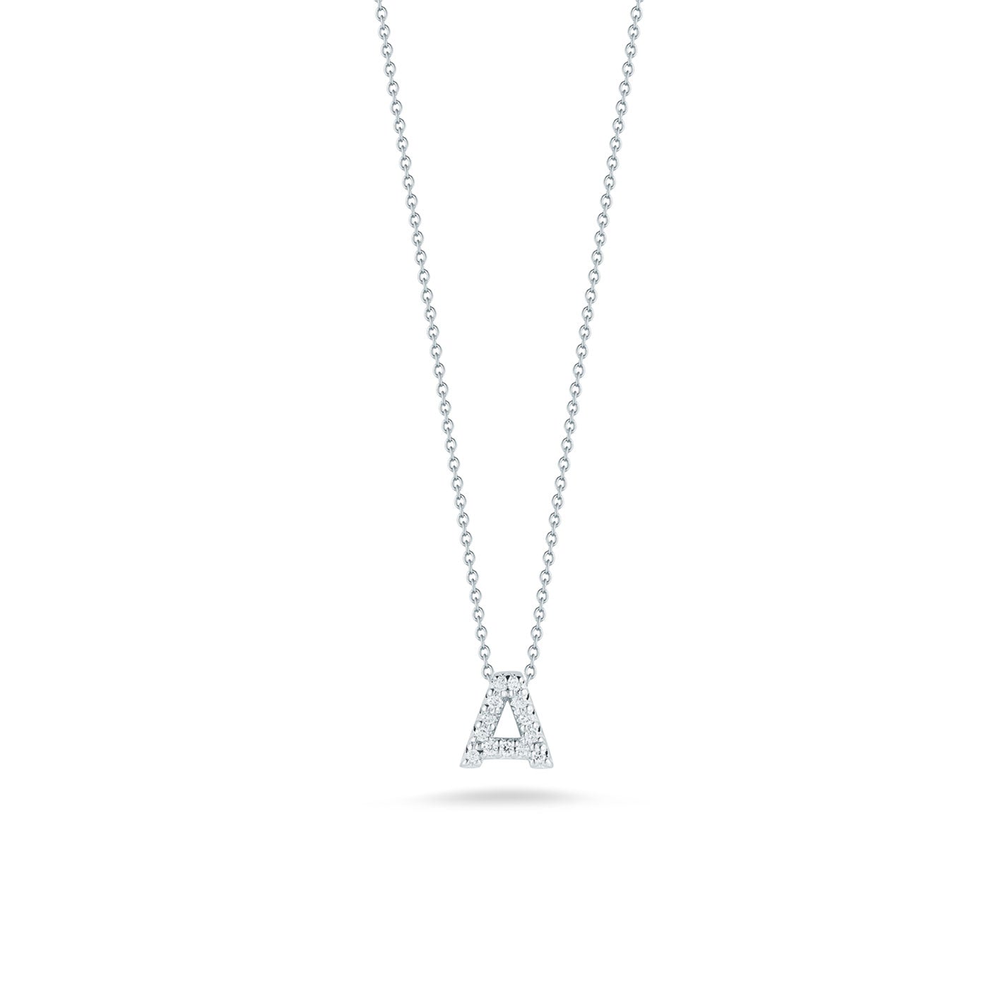 A delicate silver chain necklace showcasing the Roberto Coin Tiny Treasures 18K White Gold Diamond Initial Pendant, crafted in white gold and encrusted with small diamonds against a white background.