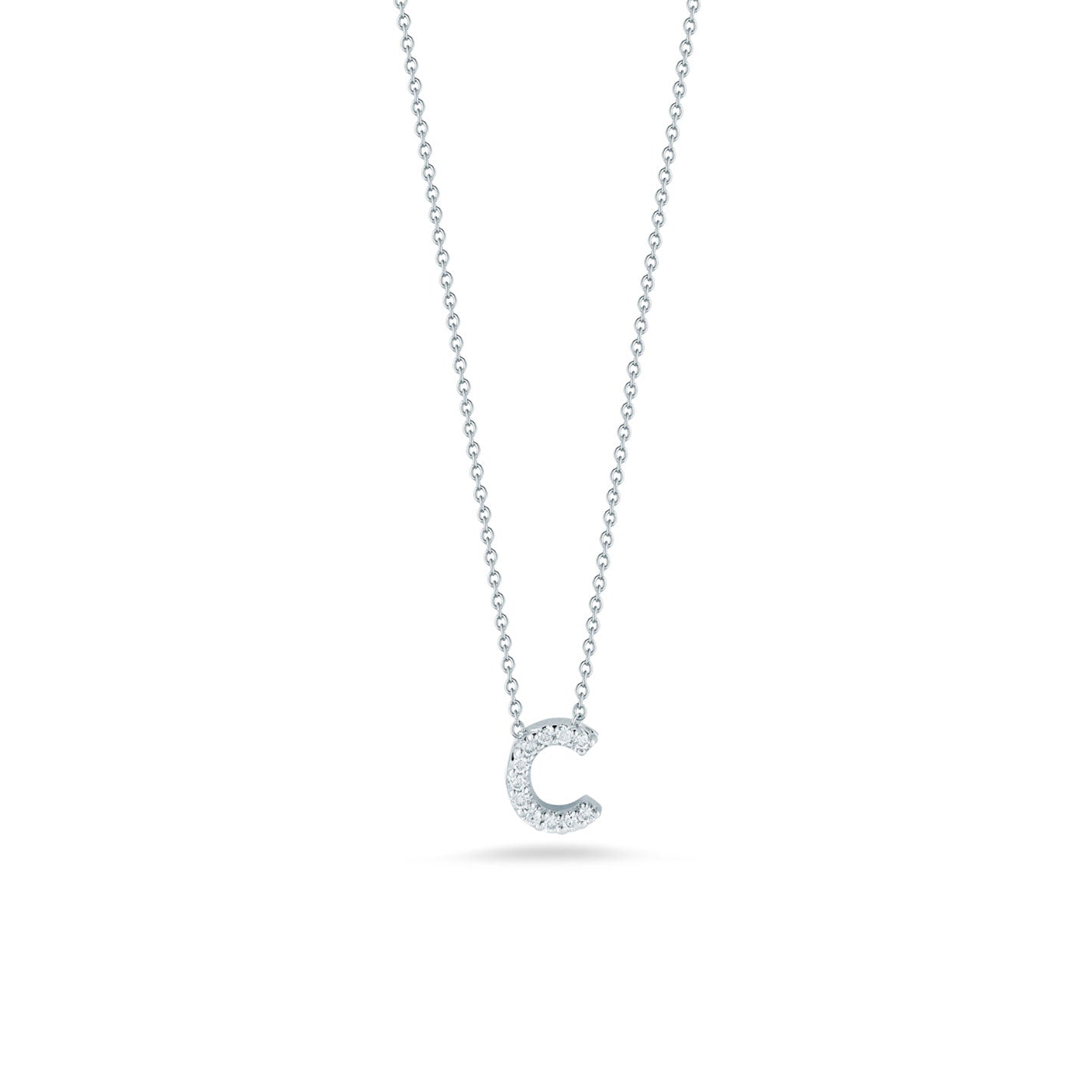 The Roberto Coin Tiny Treasures 18K White Gold Diamond Initial Necklace Pendant showcases a sparkling letter "C" adorned with round diamonds, elegantly hanging from a delicate chain against a plain white background.