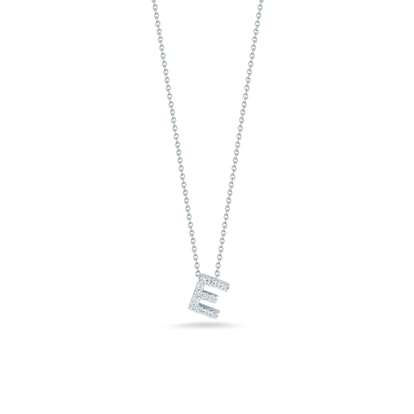 A delicate Roberto Coin Tiny Treasures necklace featuring a diamond-studded initial "E" pendant in 18K white gold, set against a plain white background.