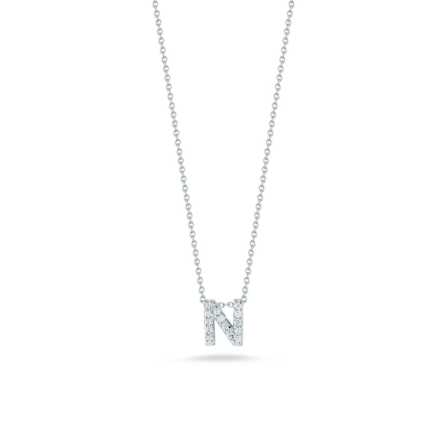 The Roberto Coin Tiny Treasures 18K White Gold Diamond Initial Necklace Pendant features a sophisticated tiny Treasures pendant shaped like the letter "N," crafted in 18 karat white gold, with a delicate chain enhancing its allure.