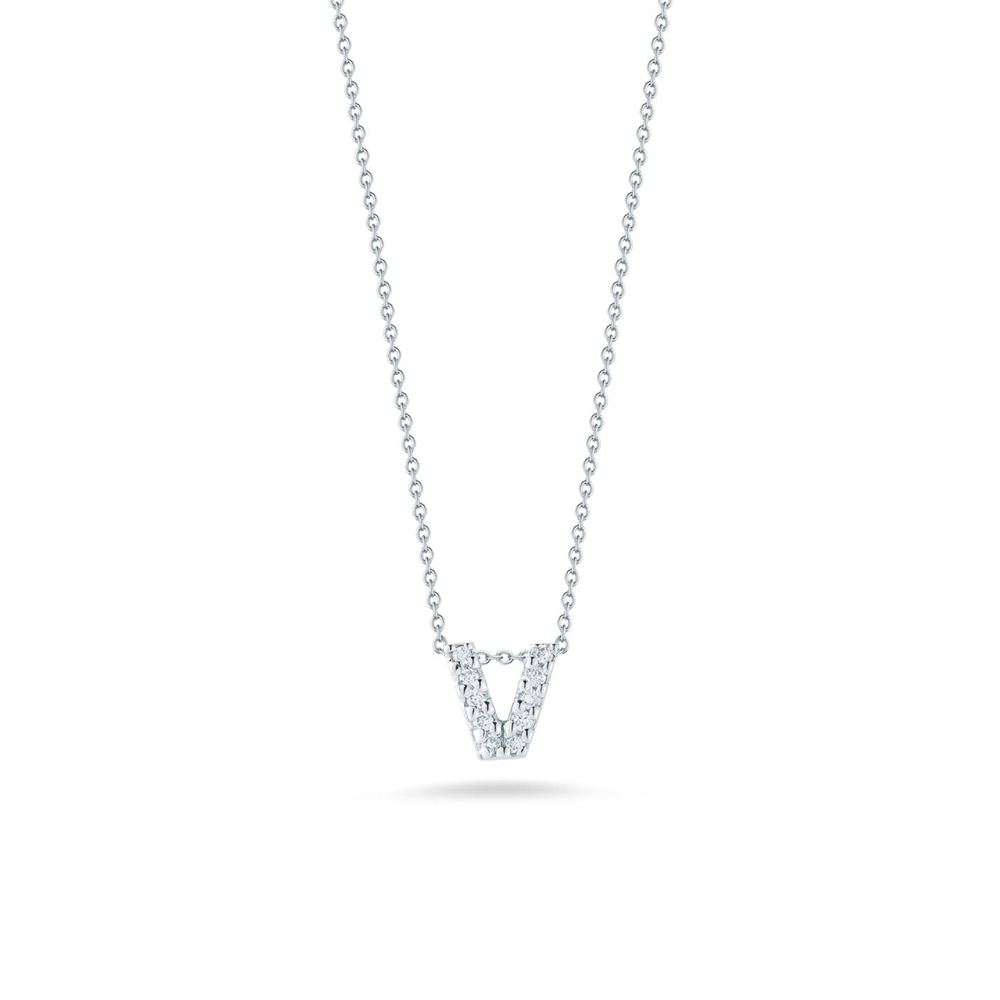 A Roberto Coin Tiny Treasures 18K White Gold Diamond Initial Necklace Pendant, crafted by Roberto Coin, showcases a "V" shaped pendant adorned with small diamonds and is elegantly suspended from a fine 18 Karat White Gold chain against a plain white background.