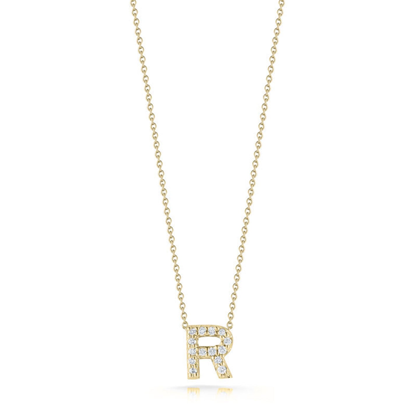 Introducing the Roberto Coin Tiny Treasures Love Letter 18K Yellow Gold Diamond Initial Necklace Pendant: a stunning piece from the renowned brand Roberto Coin. This exquisite necklace showcases a pendant in the shape of the letter "R," elegantly adorned with small diamonds. The pendant gracefully dangles from a delicate gold chain, all presented against a simple, elegant white backdrop.