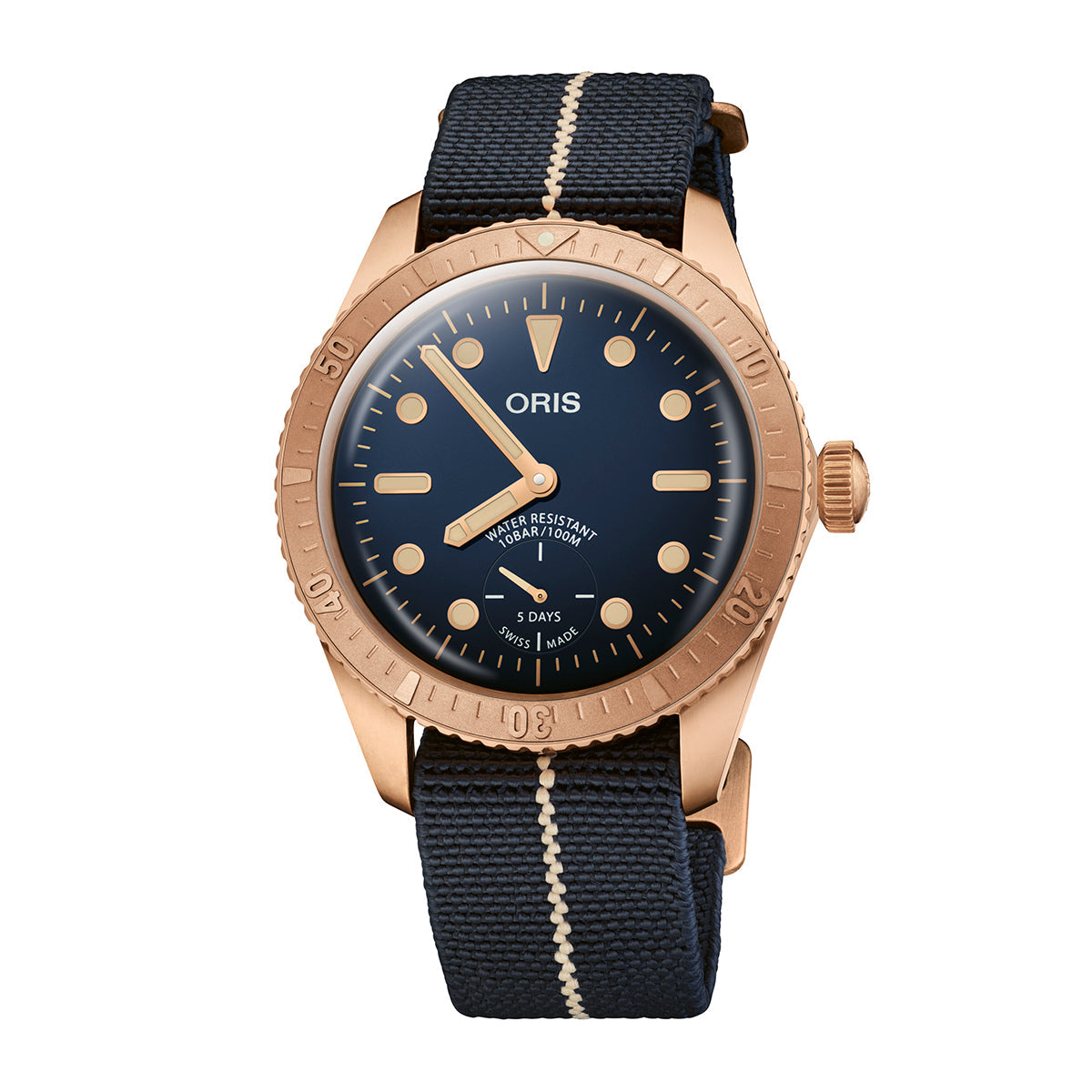 This limited edition Oris Carl Brashear Bronze Calibre 401 Automatic Winding 40mm watch, one of only 2,000 pieces, features a captivating blue dial and a dark blue fabric strap. Its distinguished hour markers, date subdial at six o'clock, knurled bezel, and sophisticated bronze case make this ORIS timepiece both unique and timeless.