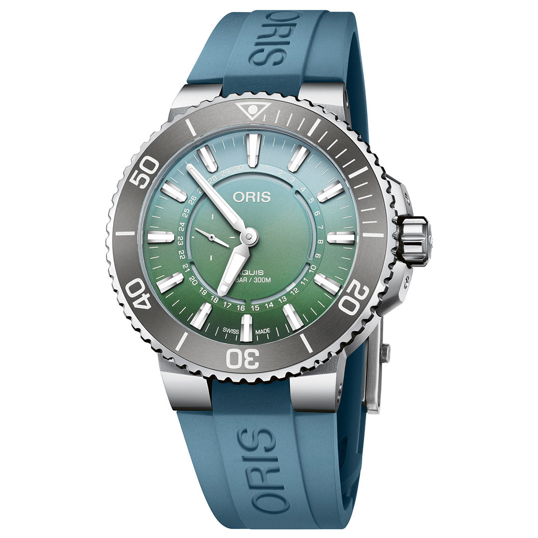 The ORIS Oris Aquis Dat Watt Limited Edition II Automatic Winding 43.5mm Watch features a gradient green dial and luminescent hour markers. It is equipped with a stainless steel case, blue rubber strap, and unidirectional rotating bezel, making it an ideal choice for marine exploration enthusiasts by combining style with precision.