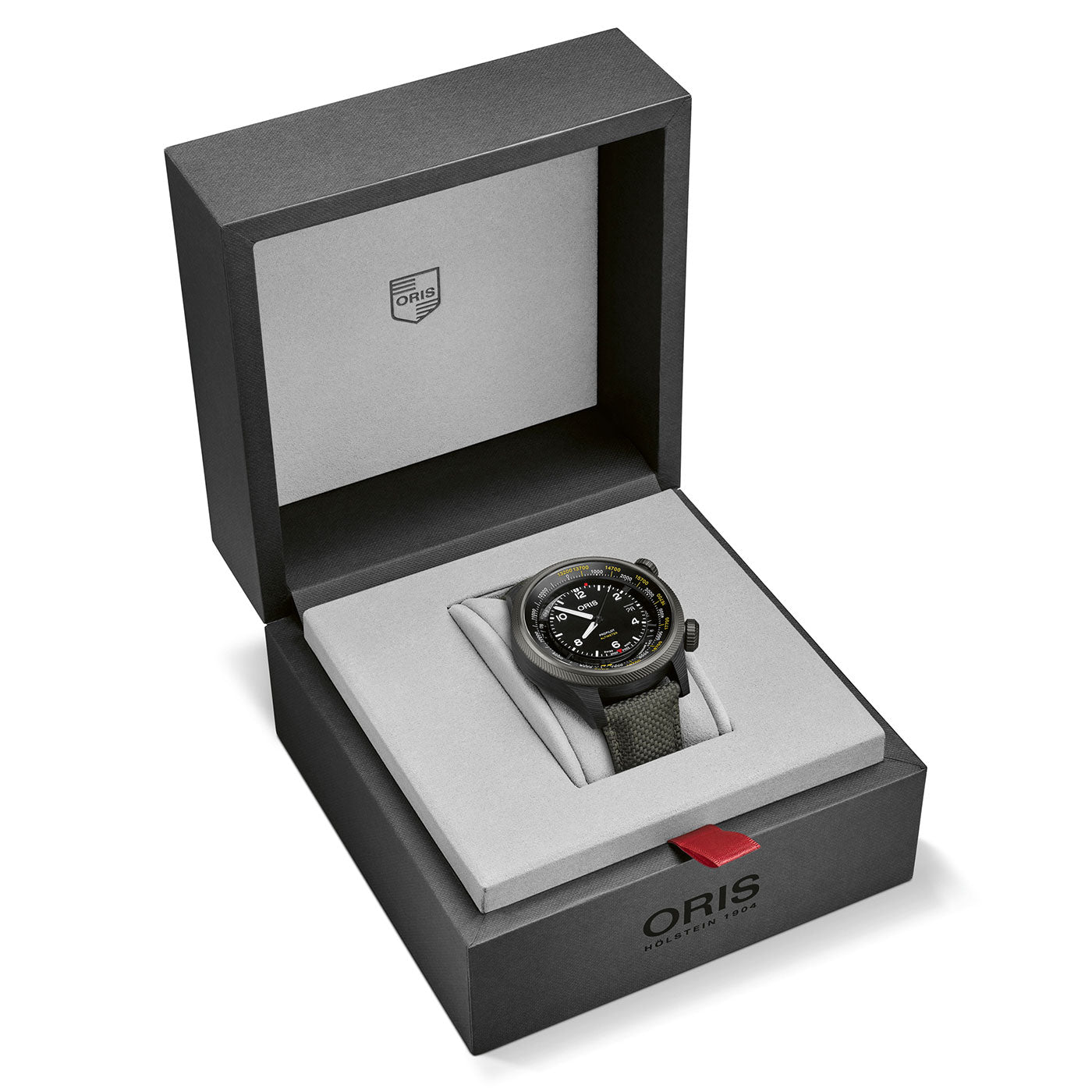 An elegant Oris Propilot Altimeter Automatic 47mm Watch with a green fabric strap is showcased in an open, branded gray and black box. The watch face features multiple dials and an intricate design, with the ORIS logo displayed on the box lid.