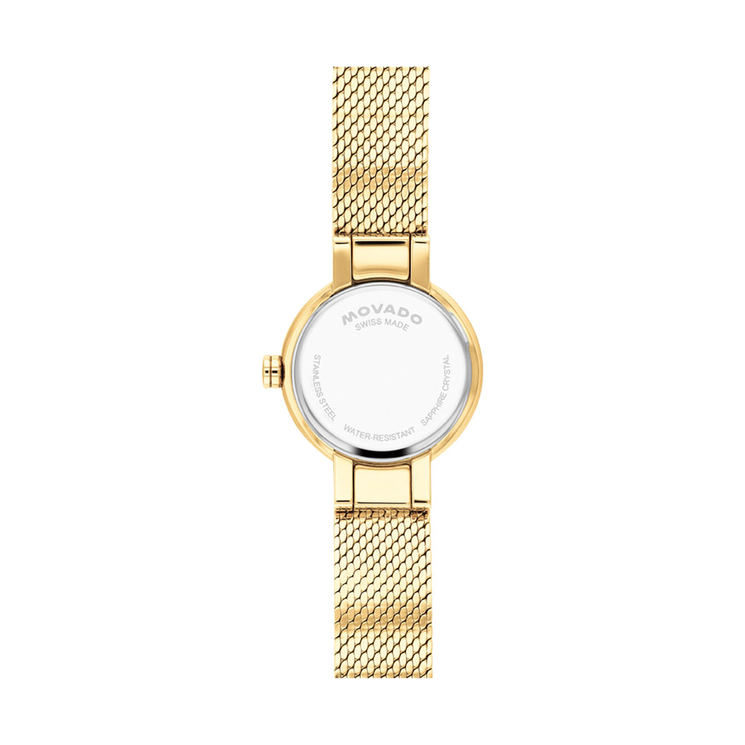 A yellow gold Movado Veluran Mini Quartz 21mm wristwatch with a Milanese mesh bracelet, viewed from the back. The round silver case displays the brand name “Movado,” along with details about water resistance, materials, and its Swiss made movement.