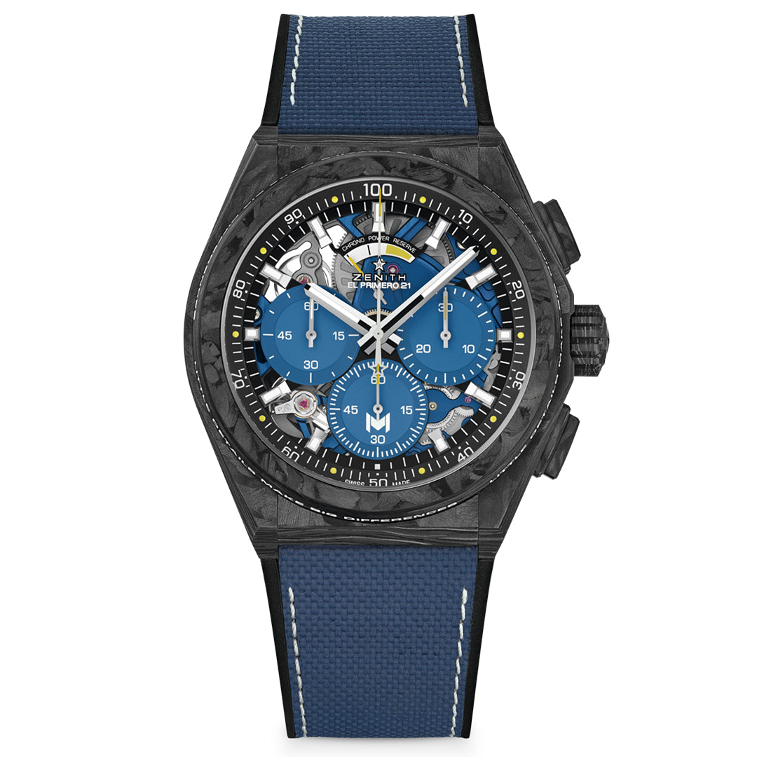 The ZENITH Defy El Primero 21 44mm Watch from Zenith features a chic black case and blue leather strap. Its dial includes multiple sub-dials with luminescent hands, a tachymetric scale, and showcases precise carbon fibre DEFY chronograph technology.