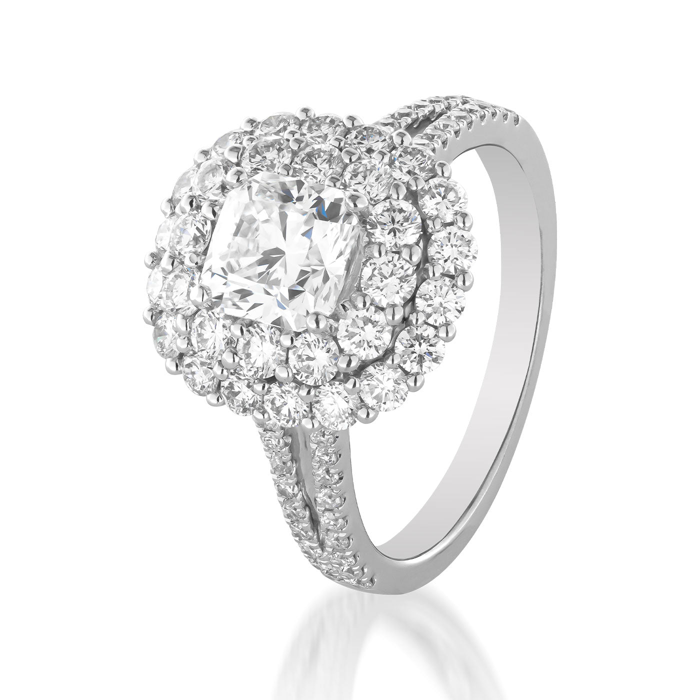 The Raffi&Co.® 18K White Gold Princess Cut Double Halo Forevermark Diamond Engagement Ring showcases a princess-cut central diamond, surrounded by a stunning array of smaller diamonds. The sophistication extends with more diamonds encrusted on the split shank band, embodying the timeless allure of a Forevermark Diamond.
