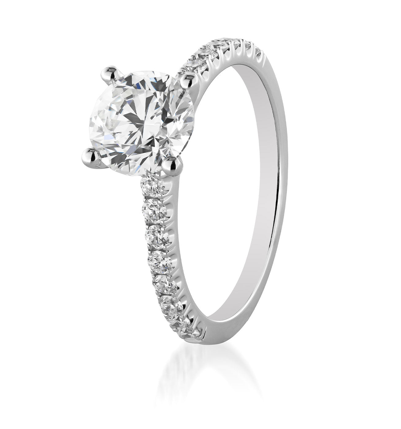 The image showcases the Raffi&Co.® 18K White Gold Round Brilliant Solitaire Diamond Engagement Ring, featuring a stunning solitaire diamond at the center. The band is elegantly adorned with smaller diamonds on both sides, set against a plain white background to enhance its sparkling beauty.