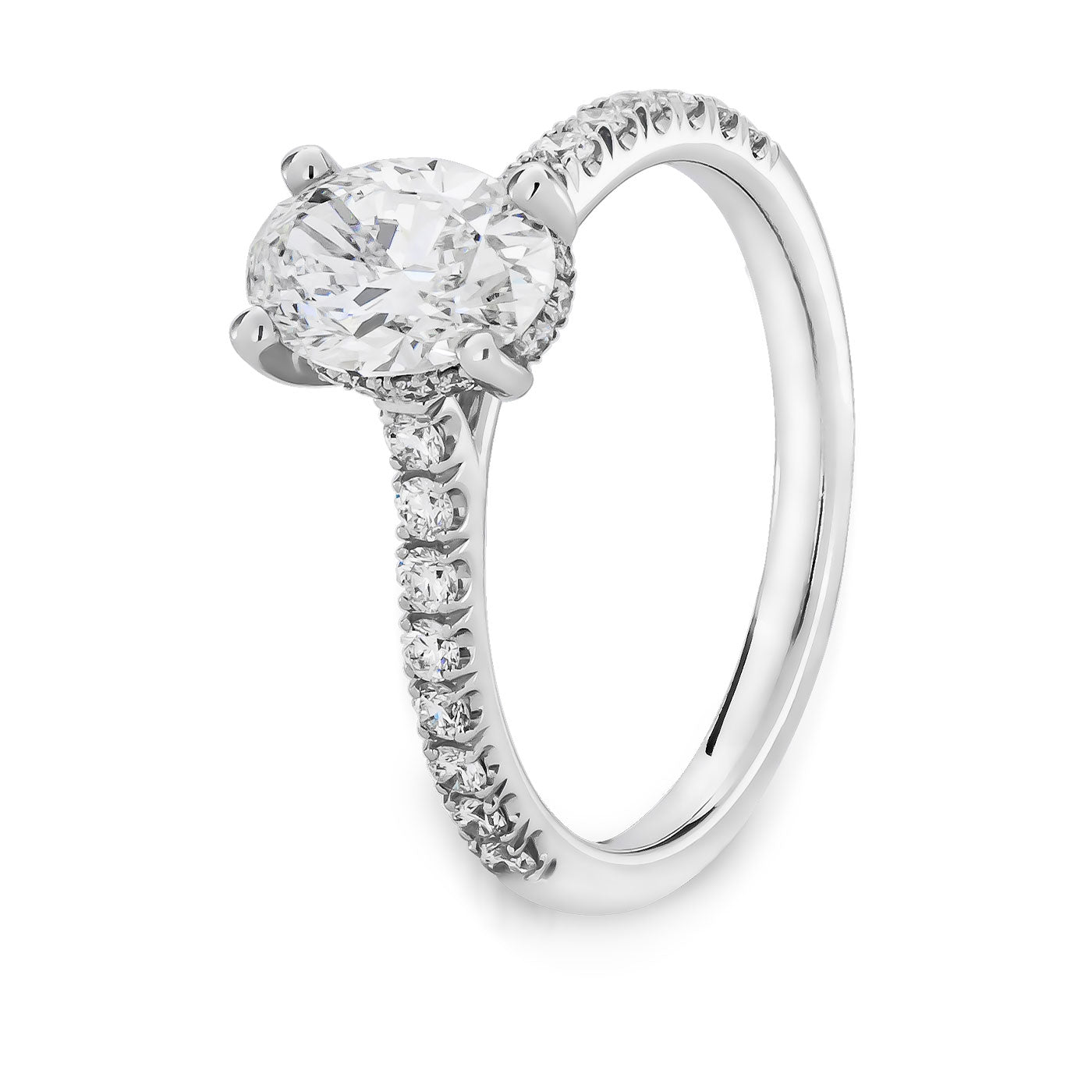 Explore the Raffi&Co.® 14K White Gold Oval with Round Brilliant Hidden Halo Diamond Engagement Ring. This exquisite piece showcases a breathtaking oval diamond centerpiece in a sophisticated four-prong setting. The band is adorned with smaller diamonds that enhance its elegance, making it a standout hidden halo engagement ring from Raffi&Co.