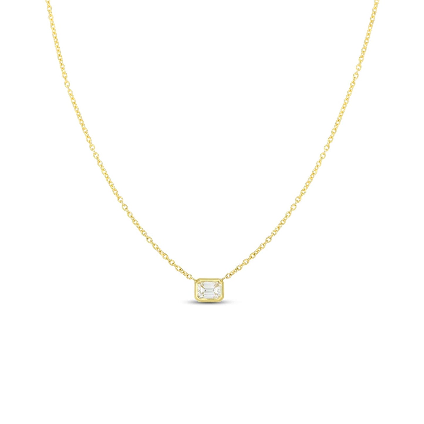 The Roberto Coin "Diamonds By The Inch" necklace showcases an 18k yellow gold chain paired with a square pendant, featuring an emerald-cut diamond at its center. This piece embodies simplicity and elegance as its thin and sophisticated chain enhances the subtle sparkle of the small pendant.