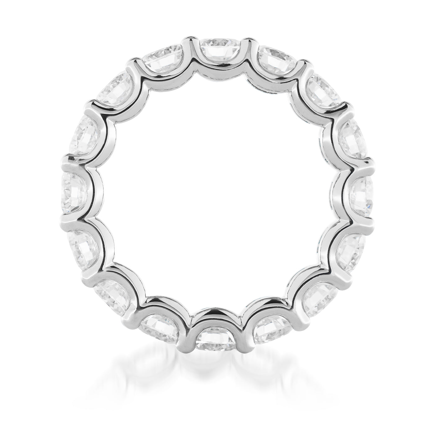Introducing the Raffi&Co.® 14K White Gold Round Brilliant Lab Diamond Eternity Ring: a stunning circular band with scalloped edges, crafted from 14K white gold. This exquisite piece elegantly displays clear, round brilliant lab diamonds encircling its perimeter, creating a captivating contrast against the pristine white backdrop.