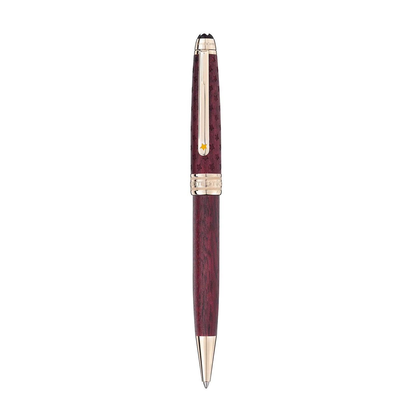 The Montblanc Meisterstuck Le Petit Prince and Planet Classique ballpoint pen exudes luxury with its polished, dark wood-like barrel and gold-colored accents, including the clip and tip. It is stylishly presented in a vertical position against a white background.