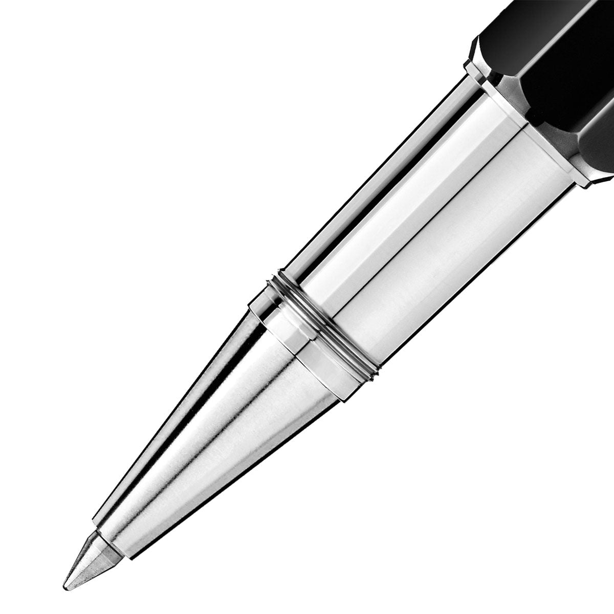 Close-up of a sleek Montblanc Heritage Egyptomania Doue rollerball pen tip against a white background. The pen's silver and black design prominently showcases the fine point and precision of this elegant Montblanc writing instrument.