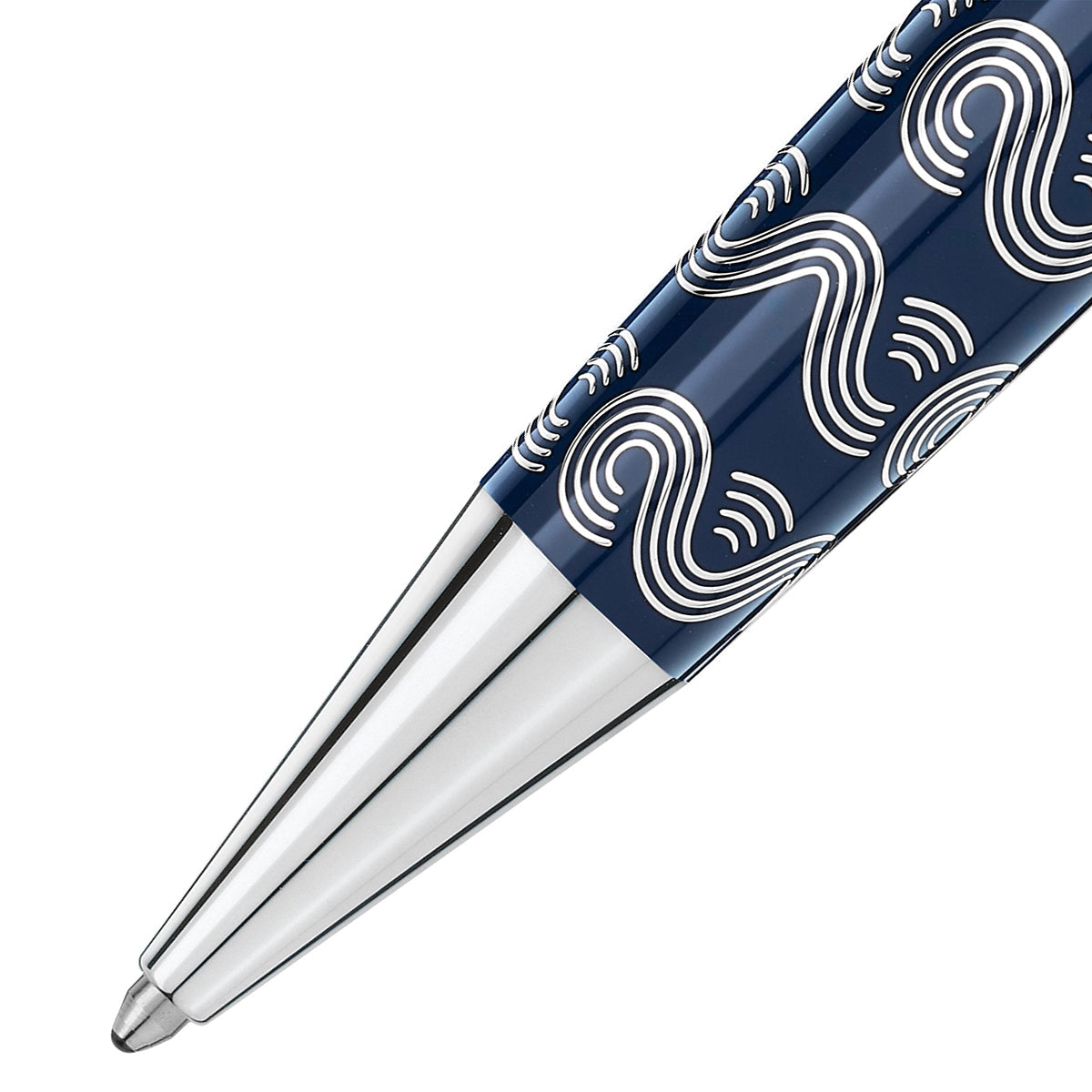 A close-up of the pen tip reveals a sleek, metallic finish. The Montblanc Meisterstück Around the World in 80 Days Solitaire Midsize Ballpoint Pen features a dark blue background embellished with white wavy line patterns and is enhanced by blue translucent lacquer, creating an artistic and modern look.