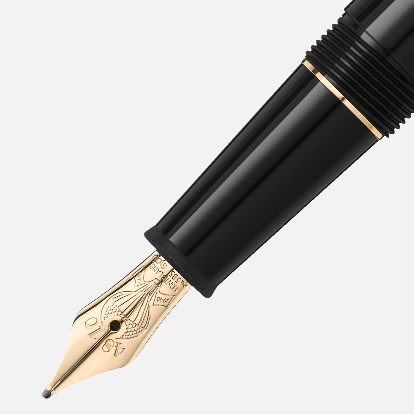 A close-up of a luxurious Montblanc Meisterstuck Around the World in 80 Days Classique Fountain Pen features a gold nib and intricate engravings. Its sleek anthracite precious resin body is adorned with gold accents, displaying an elegant design against a white background.