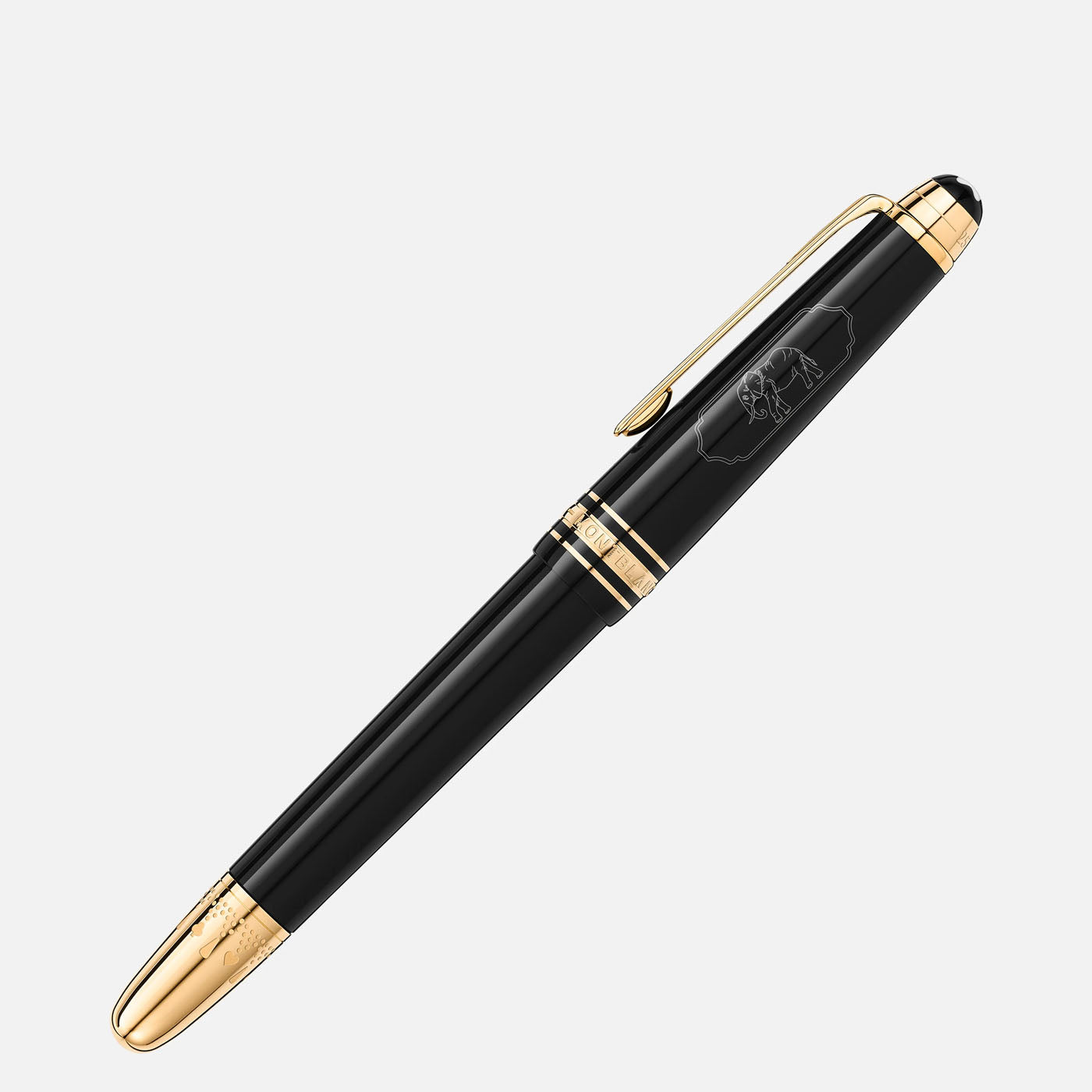 A Montblanc Meisterstück Around the World in 80 Days Classique Fountain Pen, adorned with gold accents and crafted from anthracite precious resin, lies elegantly on a white background. It showcases intricate engravings near the center and a golden clip, capturing timeless sophistication.