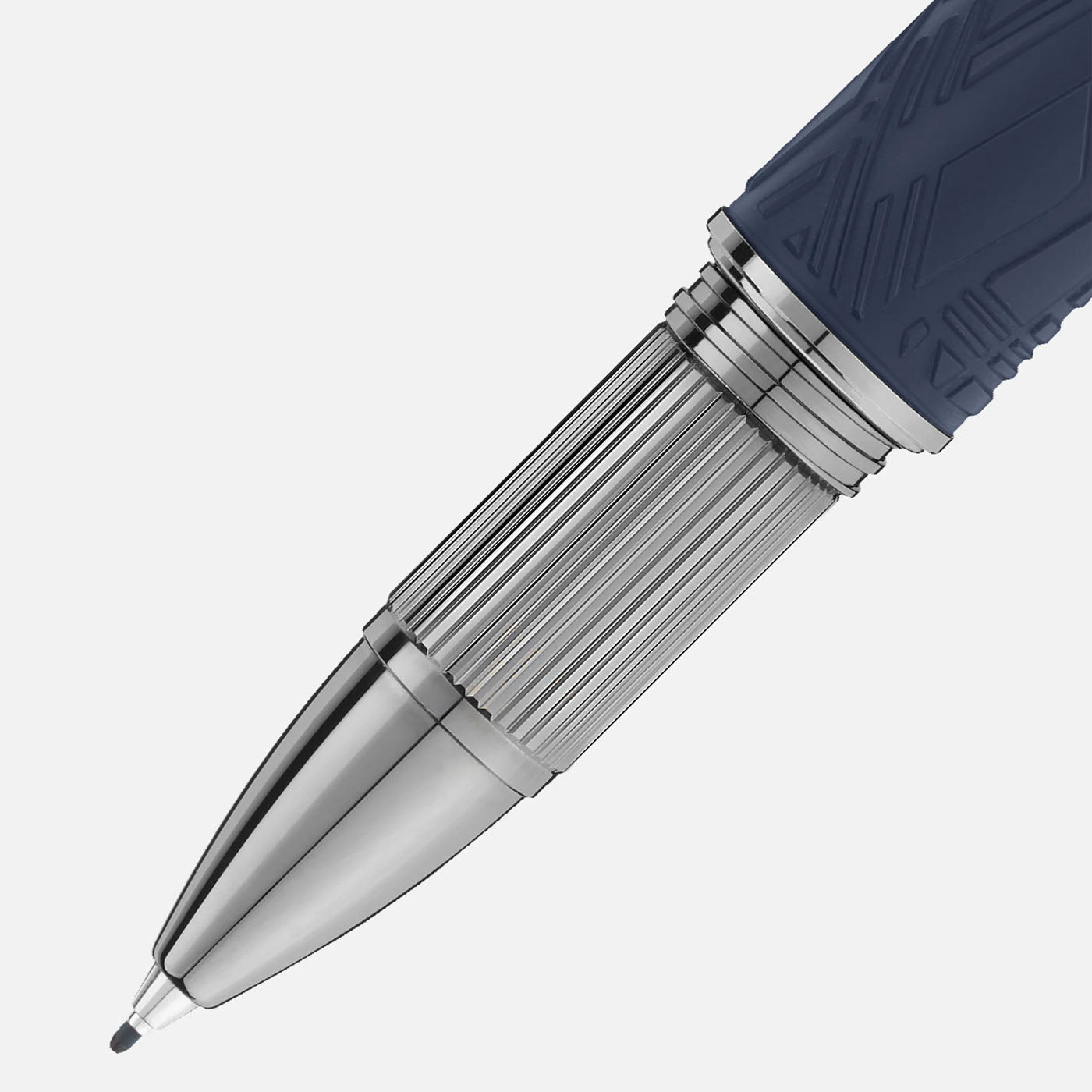 A close-up showcases the Montblanc Starwalker SpaceBlue Resin Doue Fineliner Pen, a sleek accessory with a silver tip. This elegant pen features a resin barrel with metallic accents and a textured dark blue grip, angled diagonally against a plain, light background to highlight the iconic Montblanc emblem.
