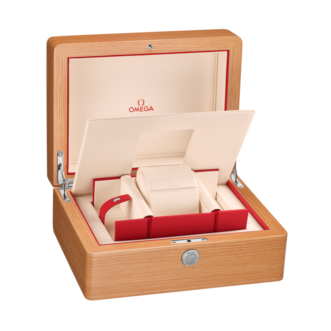 An open wooden watch box with a cream-colored interior, red accents, and a central padded holder for an OMEGA Constellation Observatory Co-Axial Master Chronometer 39.4mm Watch.