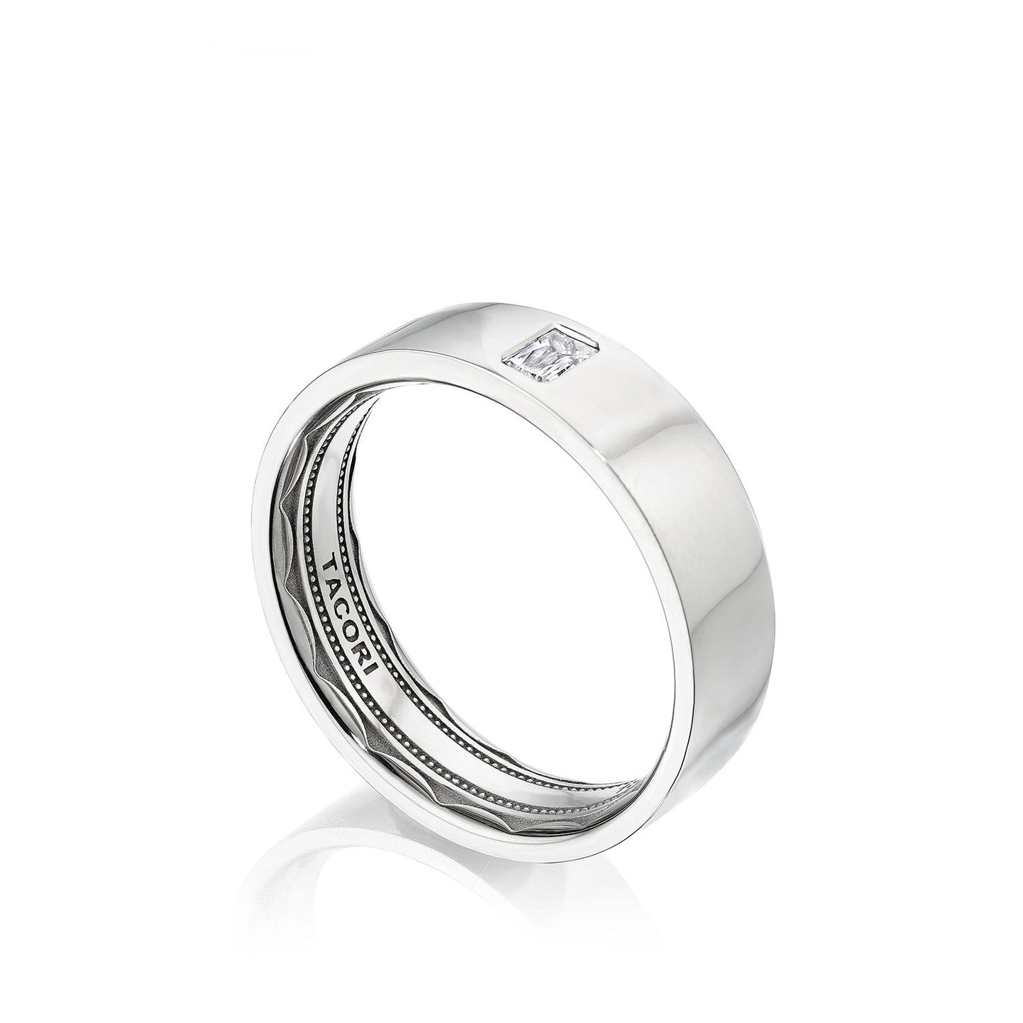 The Tacori High Polish Finish Platinum Emerald Bezel Set Diamond Wedding Band features a sleek design with a rectangular, clear gemstone elegantly positioned on its smooth band. The ring showcases intricate detailing and Tacori's signature sculpted crescent design, enhanced by a comfort fit structure, beautifully displayed against a white background.