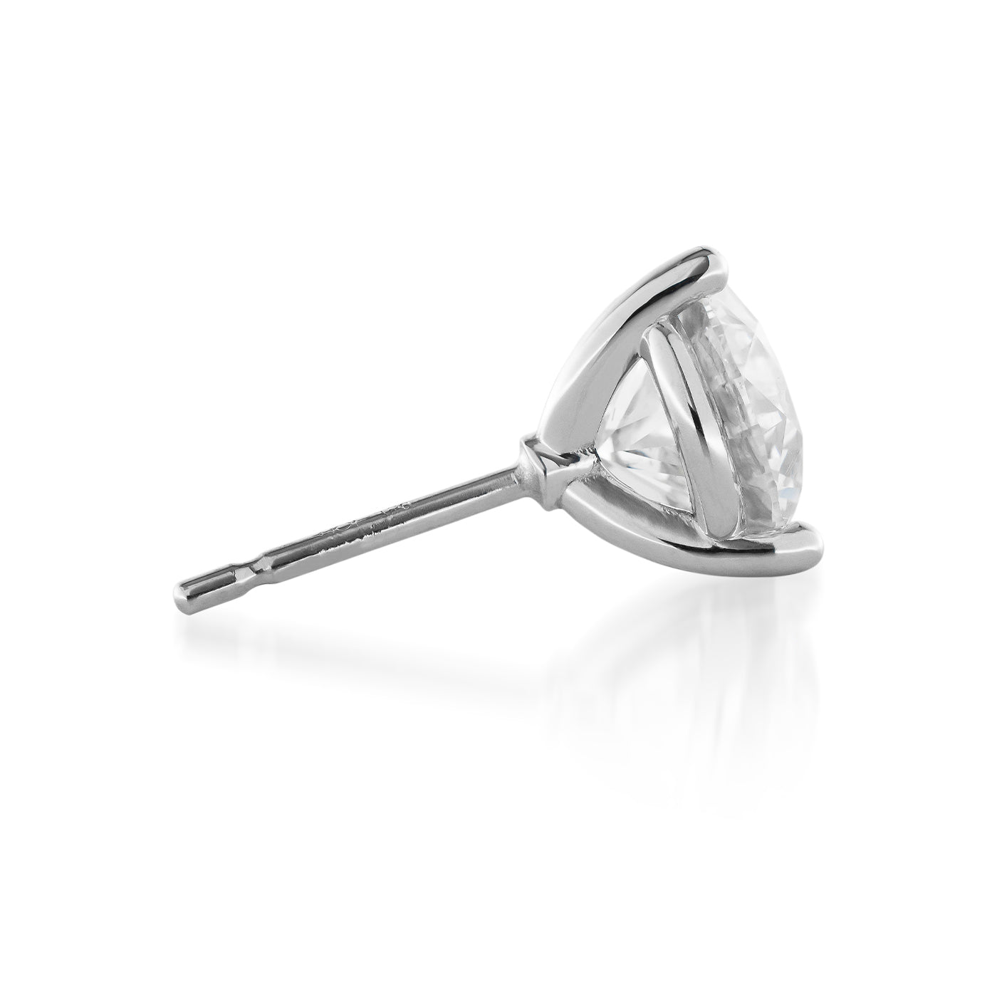 A Raffi&Co.® 14K White Gold Diamond Stud Earring, featuring a round-cut diamond in a prong setting, rests elegantly on its side against a white background.