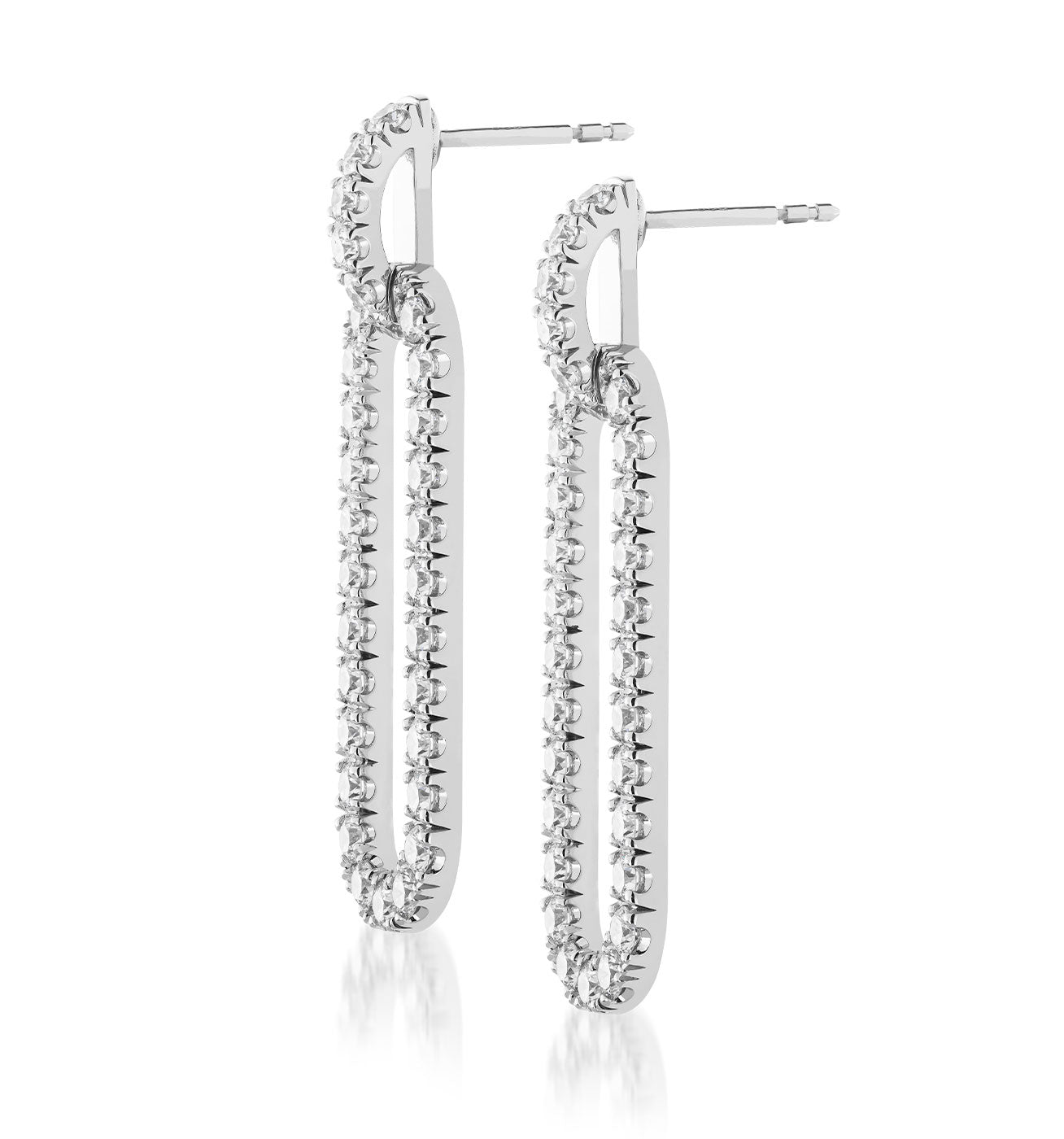 The Raffi&Co.® 14K White Gold Diamond Paper Clip Drop Earrings feature a long, elongated oval shape with small, sparkling diamonds encrusted along the outer edge. As handcrafted jewelry at its finest, they include a post and butterfly backing for secure fastening.