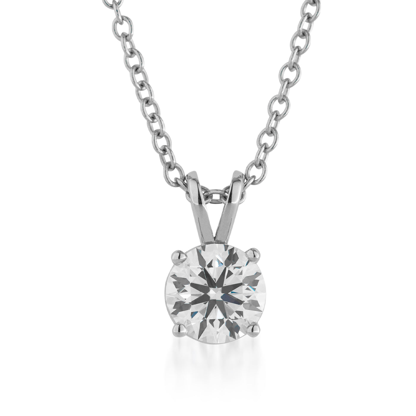 Introducing the Raffi&Co.® 18K White Gold Lab Grown Diamond Pendant Necklace—a sophisticated piece featuring a lab-grown diamond held by four prongs in a luxurious 18K white gold setting. This round diamond pendant elegantly suspends from a delicate link chain, exemplifying simplicity and refinement, with the signature quality of Raffi&Co.