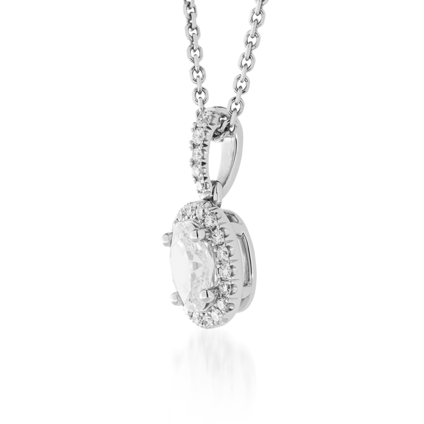 A close-up of the Raffi&Co.® 14K White Gold Round Brilliant Diamond Pendant Necklace highlights its fine craftsmanship, sparkling round diamonds, and delicate chain, set against a white background.
