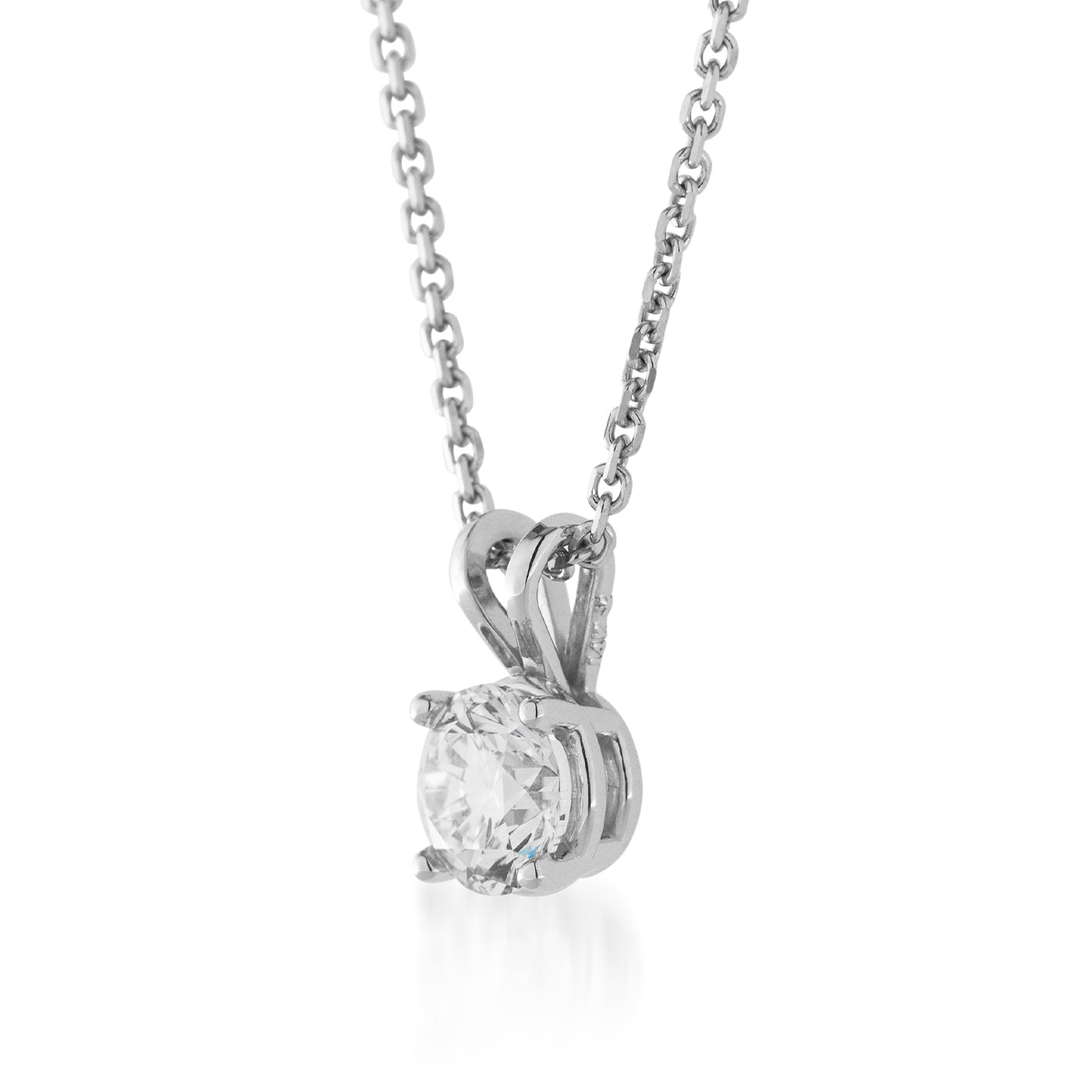 The Raffi&Co.® 14K White Gold Lab Grown Diamond Pendant Necklace highlights a solitaire lab grown diamond in a four-prong setting, adorned with a decorative bail. The round-cut diamond gleams brilliantly against the sleek, polished white gold of the chain.