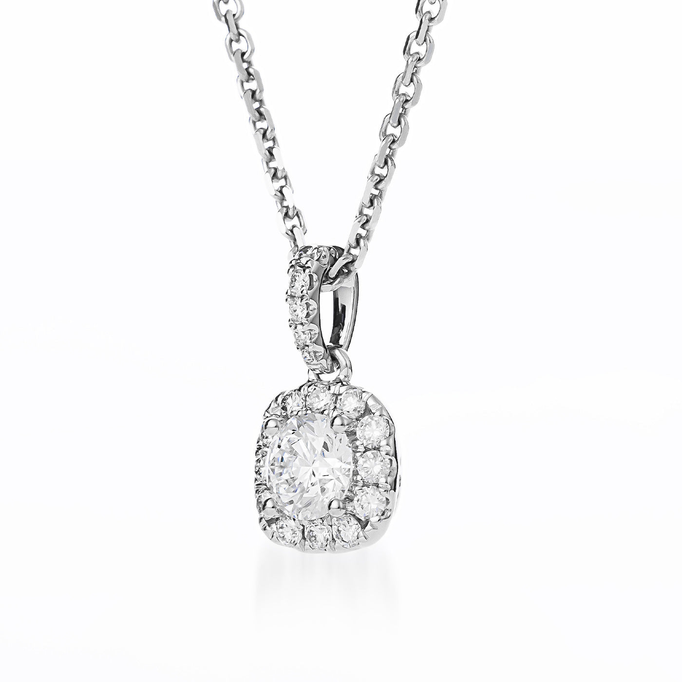 The Raffi&Co.® 18K White Gold necklace showcases a pendant adorned with a central round brilliant lab-grown diamond, beautifully accentuated by smaller mined diamonds. This stunning piece elegantly hangs from a delicate chain, embodying timeless beauty.