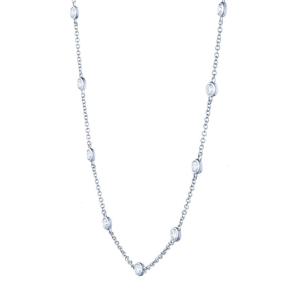 The Raffi&Co.® 14K White Gold Round Brilliant Diamond Station Necklace features a delicate chain with evenly spaced circular diamond-like stones, blending simplicity and elegance.