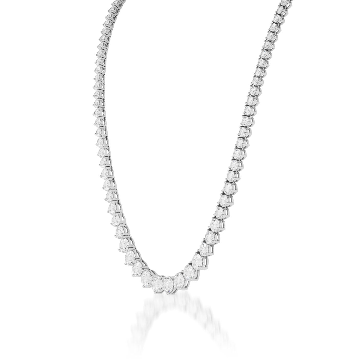 A close-up image of the Raffi&Co.® 18K White Gold Three Prong Diamond Necklace, showcasing its elegant craftsmanship. The necklace is adorned with sparkling round diamonds set closely in a three-prong setting, forming a continuous, shimmering loop. This simple and sophisticated design is perfect for formal occasions.
