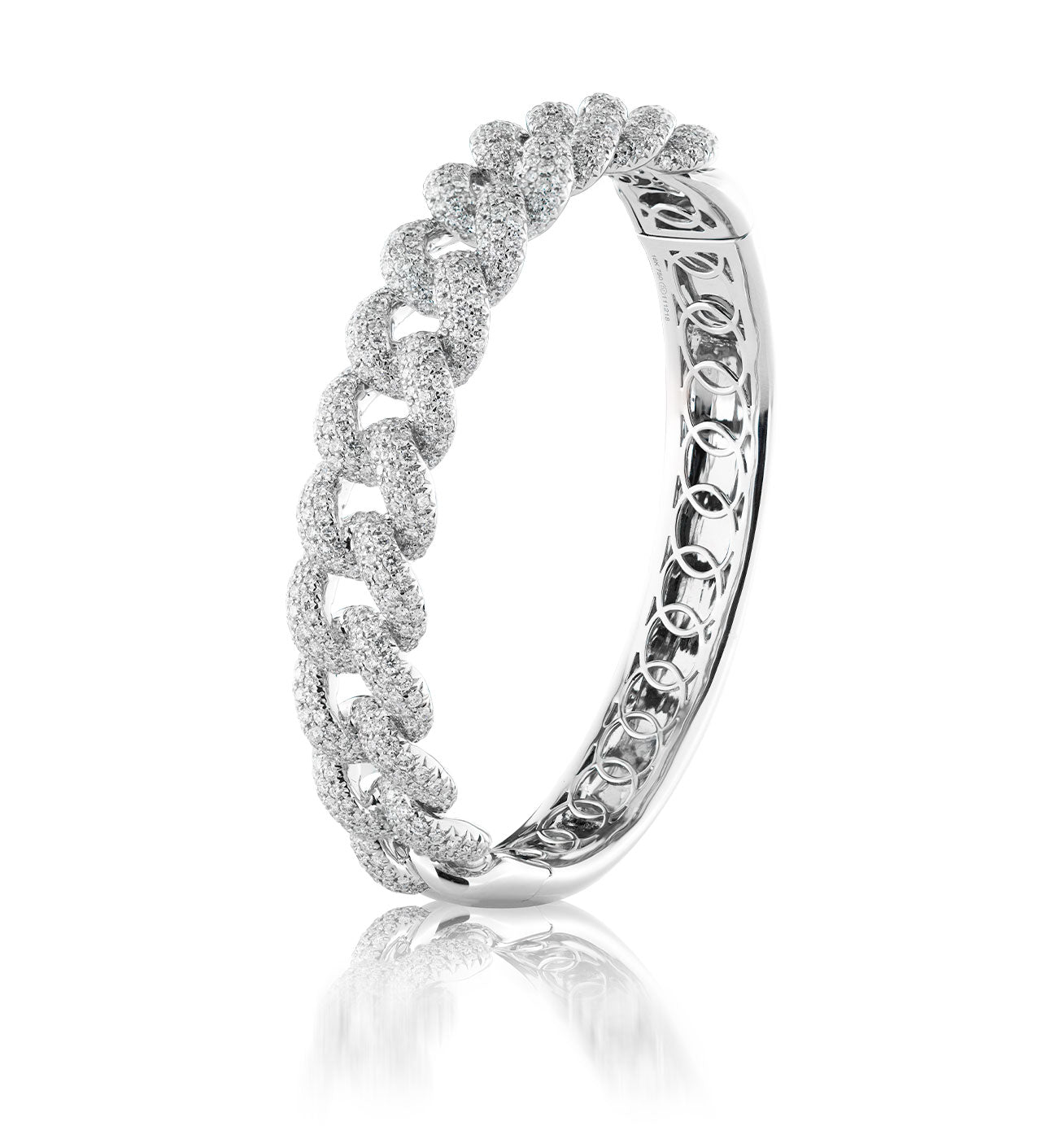 Introducing the Raffi&Co.® 18K White Gold Diamond Miami Cuban Bangle by Raffi&Co, a stunning piece featuring a textured, chain-link design with intricate craftsmanship on the top half and pavé-set diamonds. Its smooth, reflective inner surface is angled against a white background to highlight its exquisite detail.