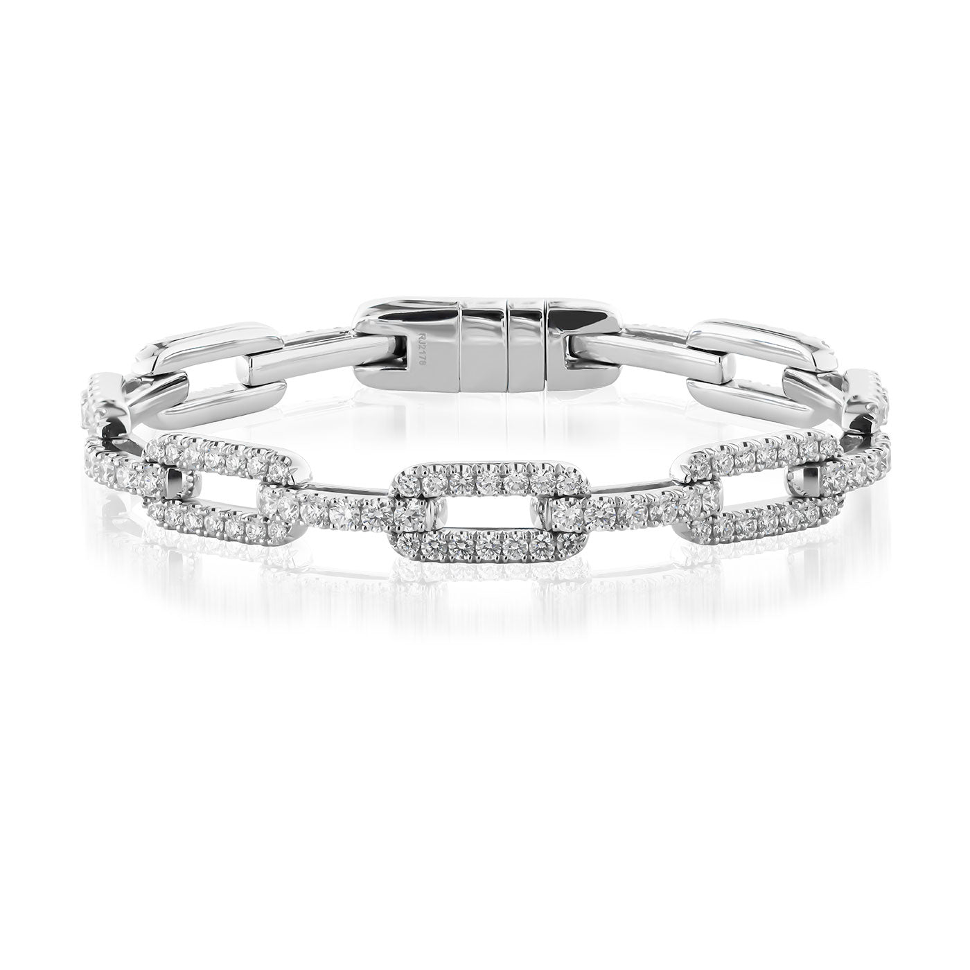 The Raffi&Co.® 14K White Gold Diamond Bracelet showcases a series of sleek, modern rectangular links, some adorned with small sparkling diamonds that elegantly capture light. This handcrafted design is perfect for those who appreciate contemporary jewelry with a touch of sophistication.