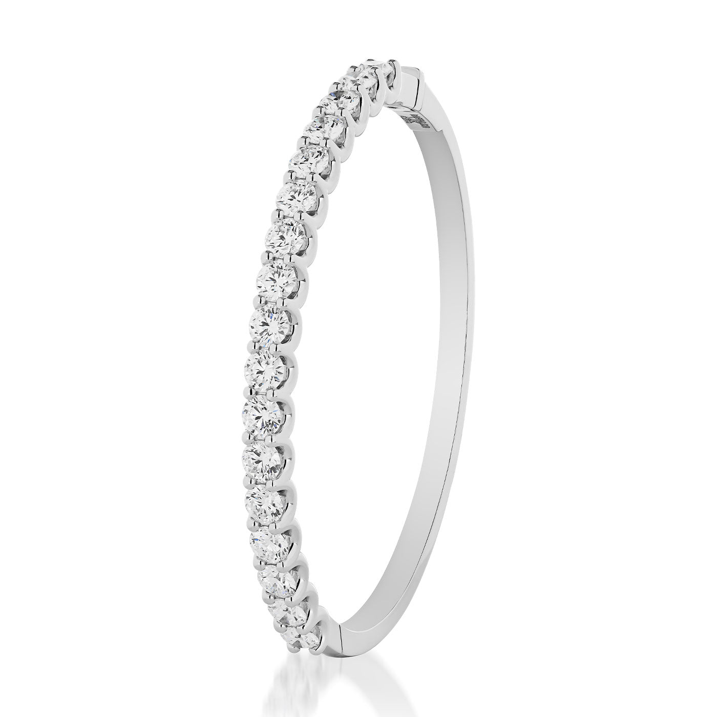 The Raffi&Co.® 14K White Gold Round Brilliant Diamond Bangle is a sophisticated statement piece, featuring gleaming round diamonds spaced evenly along the top half of its sleek silver design. It stands upright on a white background, showcasing its elegance and luxurious shine.