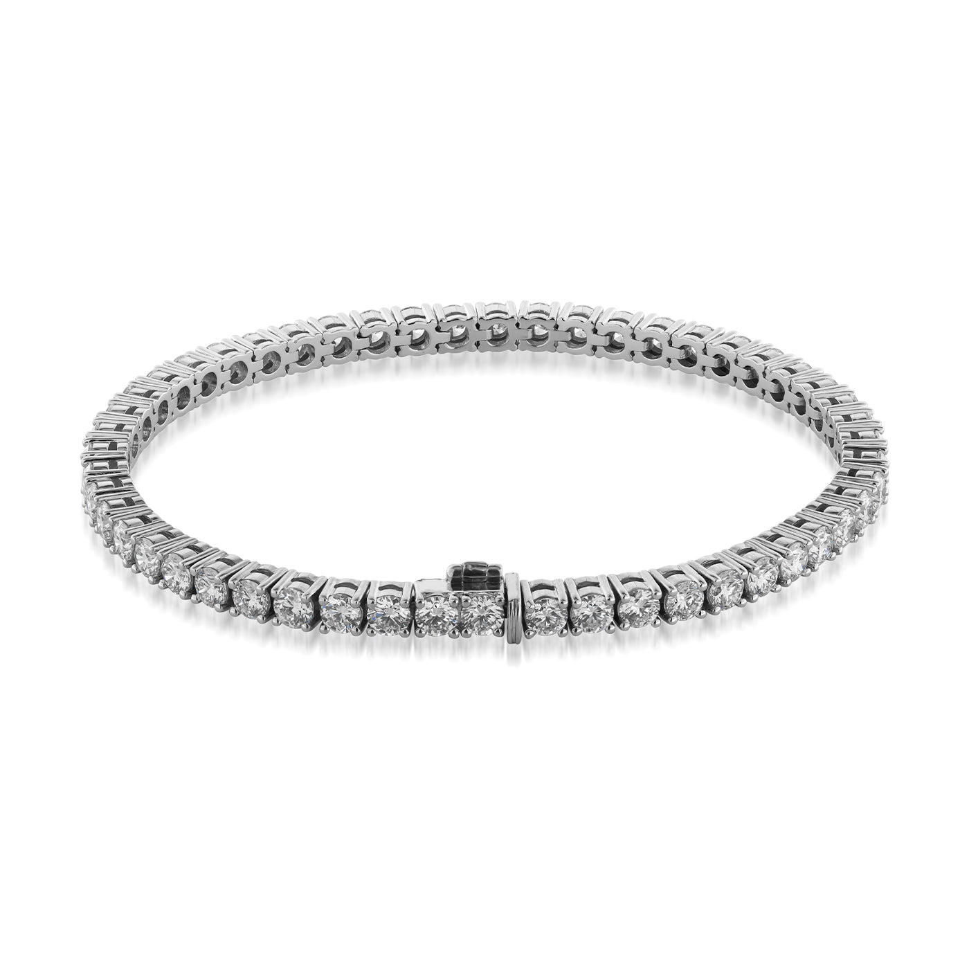 The Raffi&Co.® 14K White Gold Lab Grown Diamond Tennis Bracelet displays its refined elegance with lab-grown diamonds that shimmer and are evenly distributed around the band, creating a circular formation on a reflective white backdrop that accentuates its simplicity.
