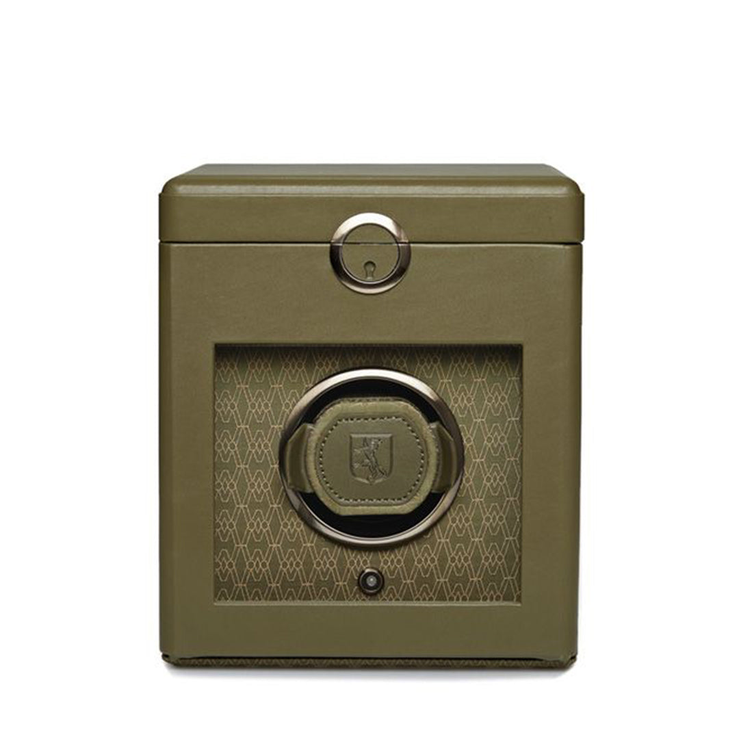 The WOLF 1834 Earth Single Watch Winder by WOLF is a green luxury watch winder with a glossy finish and cutout front, featuring patented innovation. This Bluetooth-enabled watch winder showcases a single dynamic cuff with a decorative pattern on the front panel and includes a silver-toned circular lock on top.