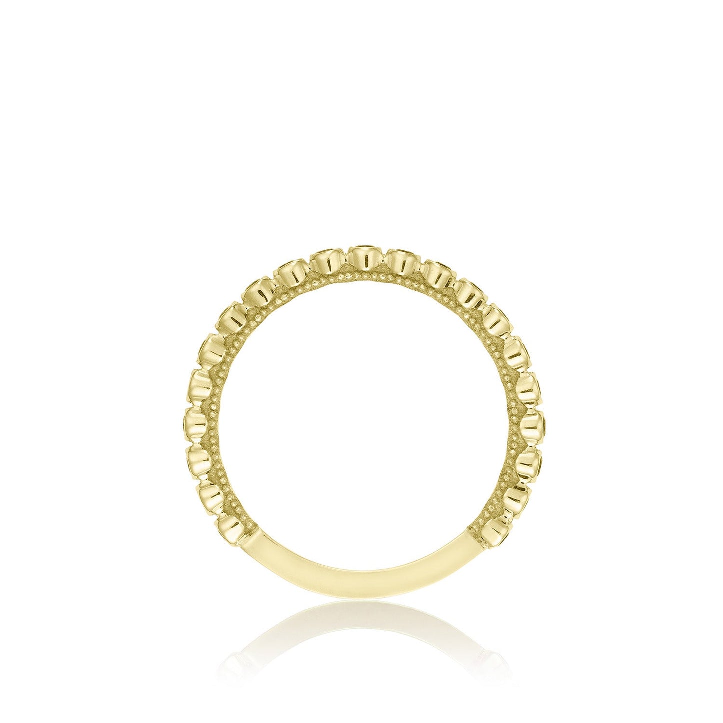 The Tacori Sculpted Crescent 18K Yellow Gold Round Brilliant Bezel Droplet Emerald Anniversary Ring, crafted by Tacori, is showcased with a beaded texture around the band against a white background.
