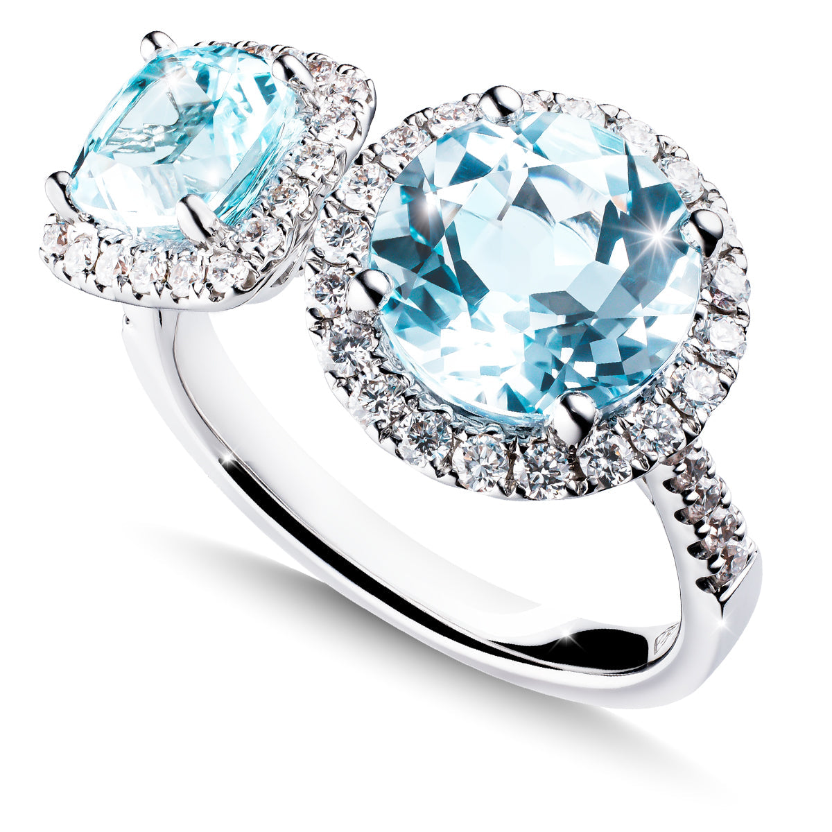 The Raffi&Co.® 18K White Gold Fashion Ring showcases a round and cushion-cut blue topaz encircled by clear diamonds, with the band adorned with small diamonds on one side.