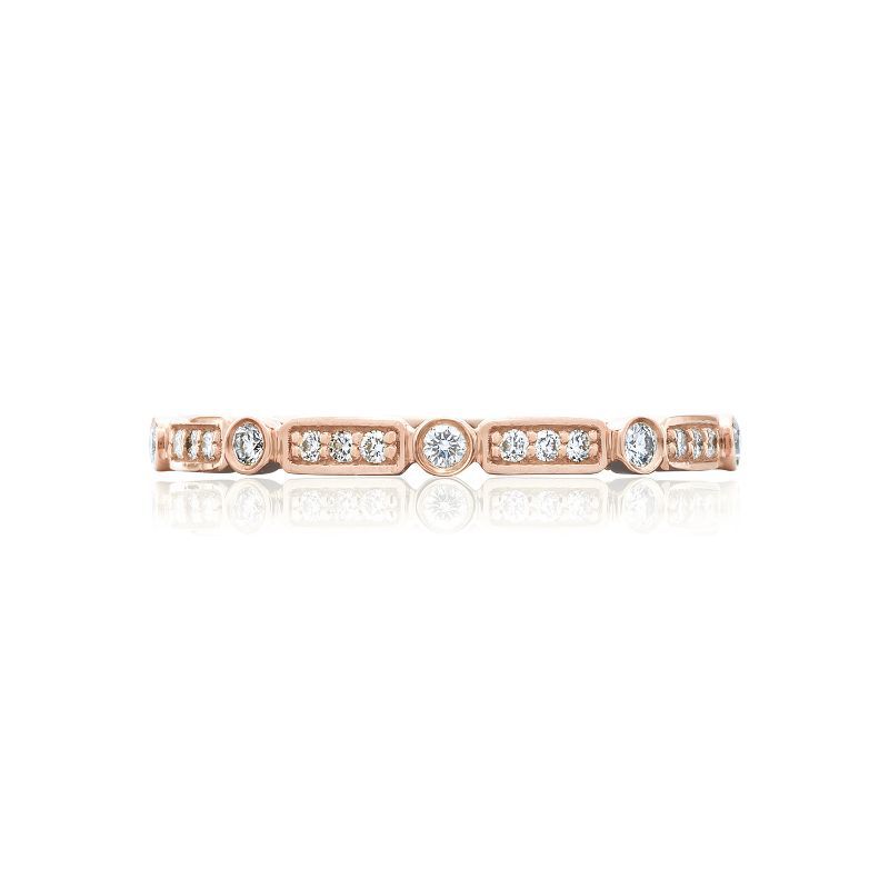 The Tacori Sculpted Crescent 18K Rose Gold Round Brilliant Bezel Droplet Diamond Anniversary Ring by Tacori features a series of round diamonds set in bezels, beautifully spaced along the band. Its symmetrical design exudes charm, with reflections shimmering against a white background, making it an ideal choice for those seeking unique engagement rings.