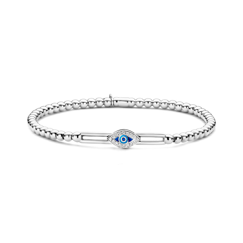 The Hulchi Belluni 18K White Gold Diamond and Sapphire Bracelet features a central evil eye charm with blue and white details, accented by a 0.09 CTW diamond, set on a smooth, reflective white background.