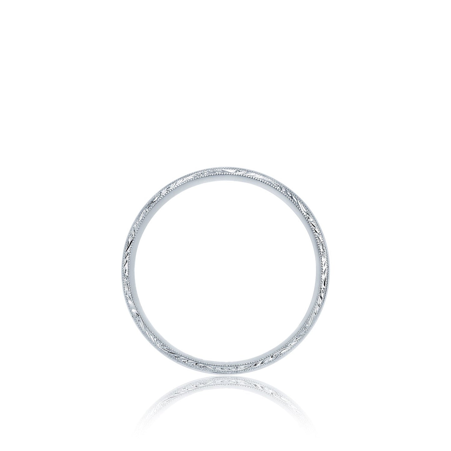 The Tacori Platinum Wedding Band, a sleek and minimalist ring with delicate engraved patterns on its surface, is showcased against a white background.