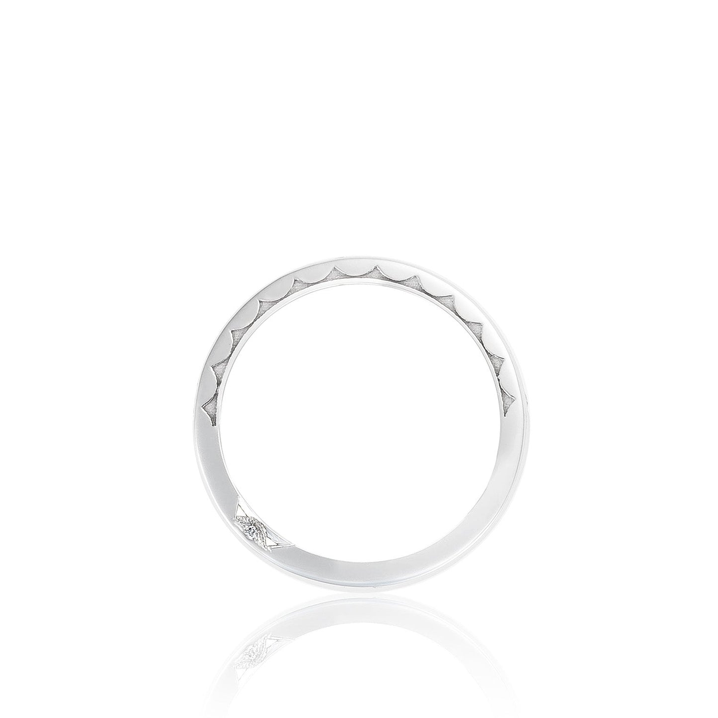A delicate Tacori Dantela 18K white gold ring featuring a sophisticated triangular pattern along the band and a small diamond accent, artfully presented against a plain white backdrop.
