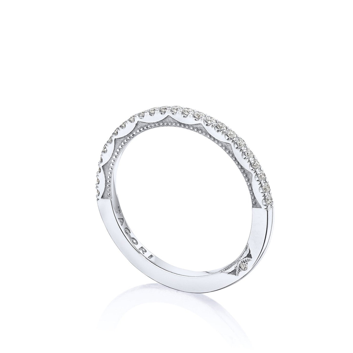 A stunning Tacori Sculpted Crescent 18K white gold anniversary ring, featuring a polished finish and small diamonds along the top half, is elegantly displayed against a plain white background. Inside the band, "Tacori" is beautifully engraved, symbolizing timeless love.