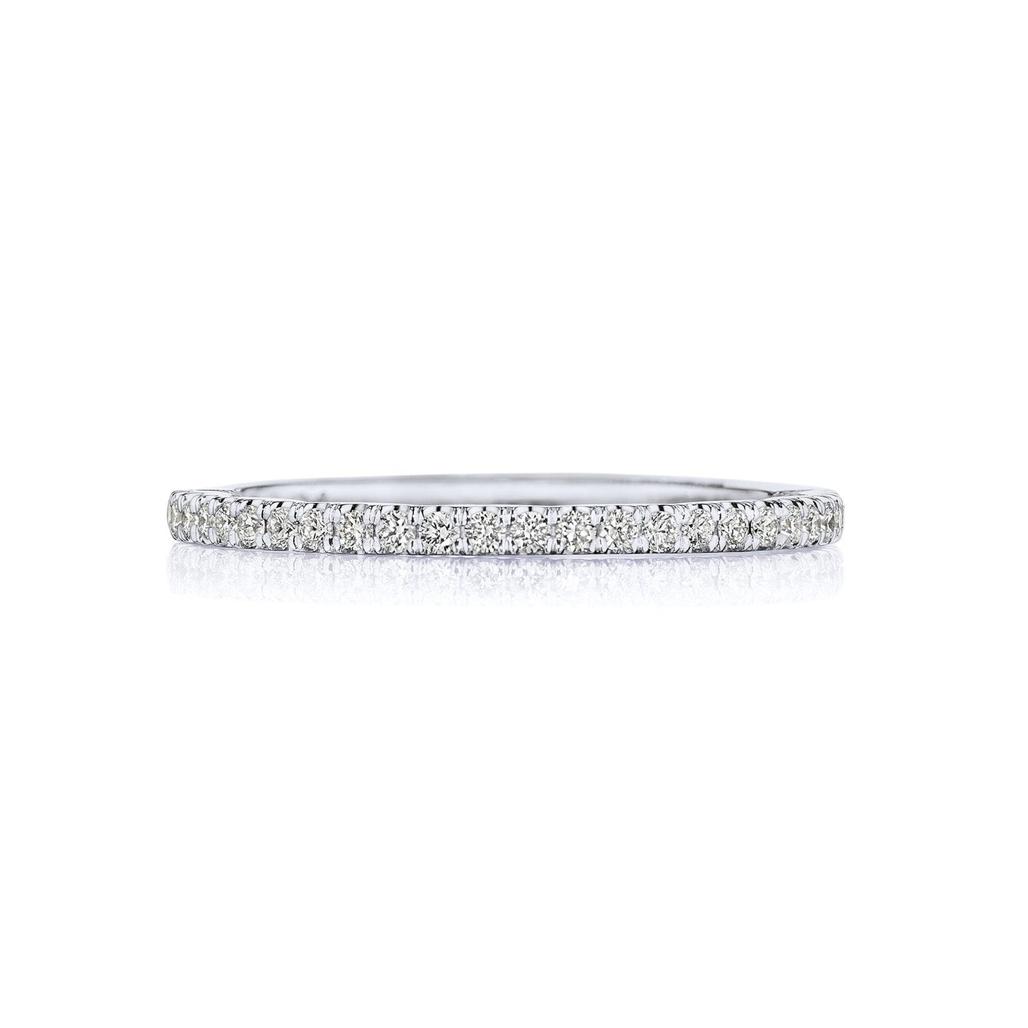 The Tacori Sculpted Crescent 18K White Gold Round Brilliant Diamond Anniversary Ring features a delicate design with a continuous row of small, sparkling diamonds, perfect for discerning engagement ring enthusiasts. Set against a plain white background, its exquisite artistry shines through.