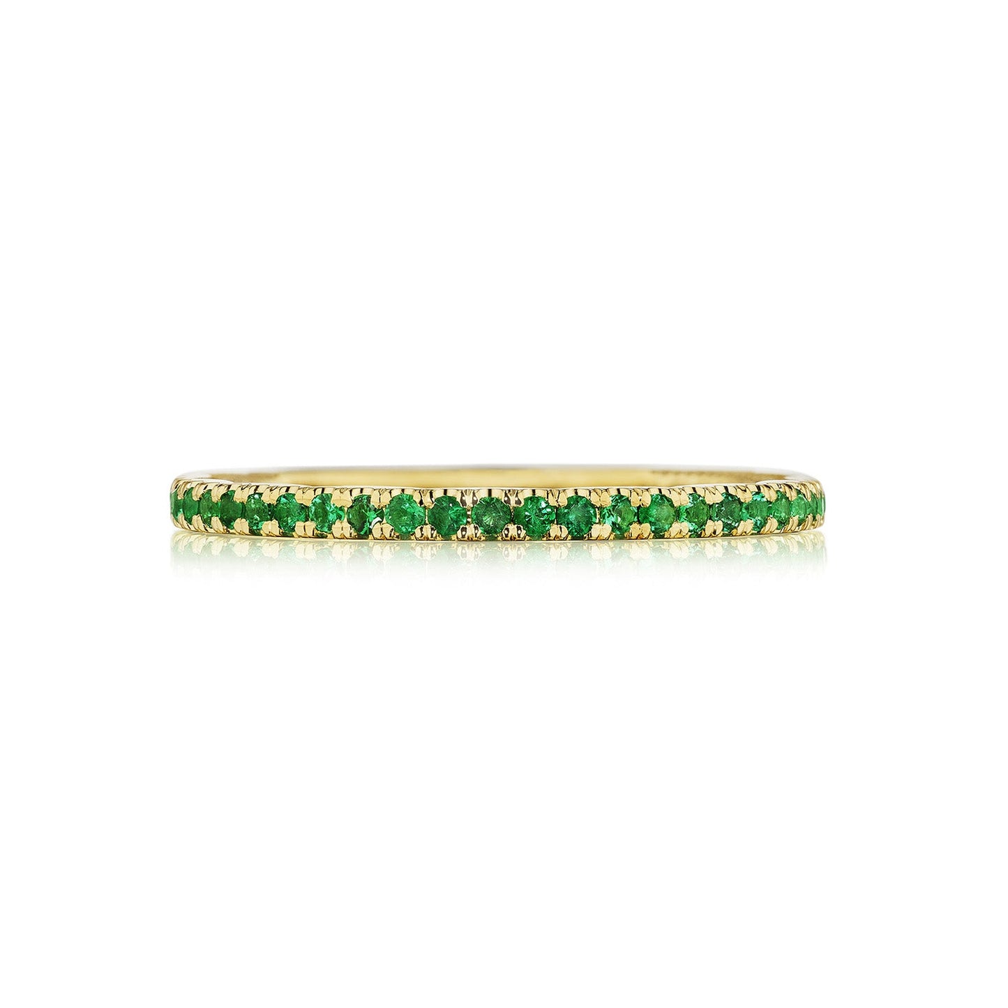 The Tacori Sculpted Crescent 18K Yellow Gold Ring is a thin and elegant piece adorned with a continuous row of vibrant green round brilliant emeralds, making it a unique choice for an engagement ring.