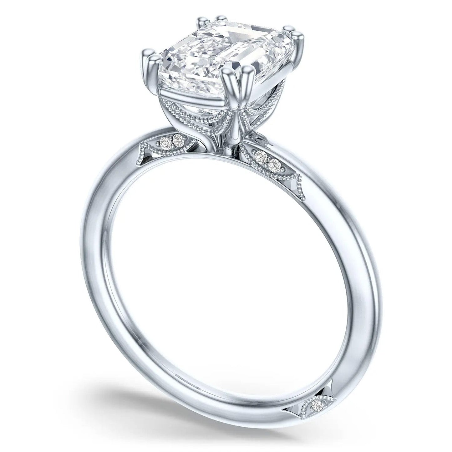 The Tacori Simply 18K White Gold Emerald Solitaire Semi Mount Engagement Ring with Diamond Accent Band is a stunning piece that features a large rectangular diamond in a four-prong setting. Crafted by Tacori gemologists, this breathtaking ring showcases the Signature Crescent band with intricate designs adorned with smaller embedded diamonds, beautifully highlighting its exquisite side profile and details.