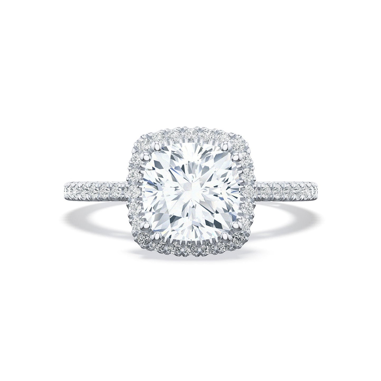 The Tacori Simply Tacori 18K Yellow Gold Cushion Semi Mount with Diamond Band and Halo Engagement Ring features a stunning center cushion-cut diamond surrounded by a sparkling halo of smaller diamonds. Its band, designed with the elegance reminiscent of a Cathedral foundation, is encrusted with additional diamonds to enhance its overall brilliance.