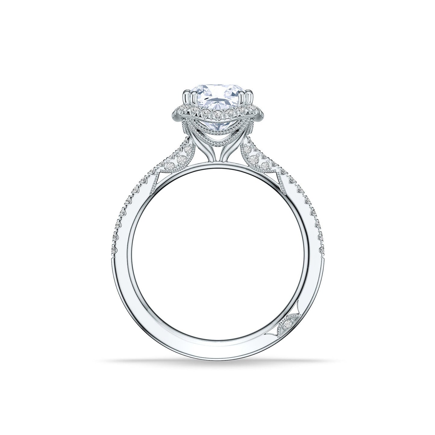 Side view of the Tacori Simply Tacori 18K Yellow Gold Cushion Semi Mount Engagement Ring, featuring a large central diamond set within a shimmering halo. The intricate design is accentuated by smaller stones encircling the centerpiece, while additional diamonds embellish the Cathedral foundation band, epitomizing elegance and sophistication.